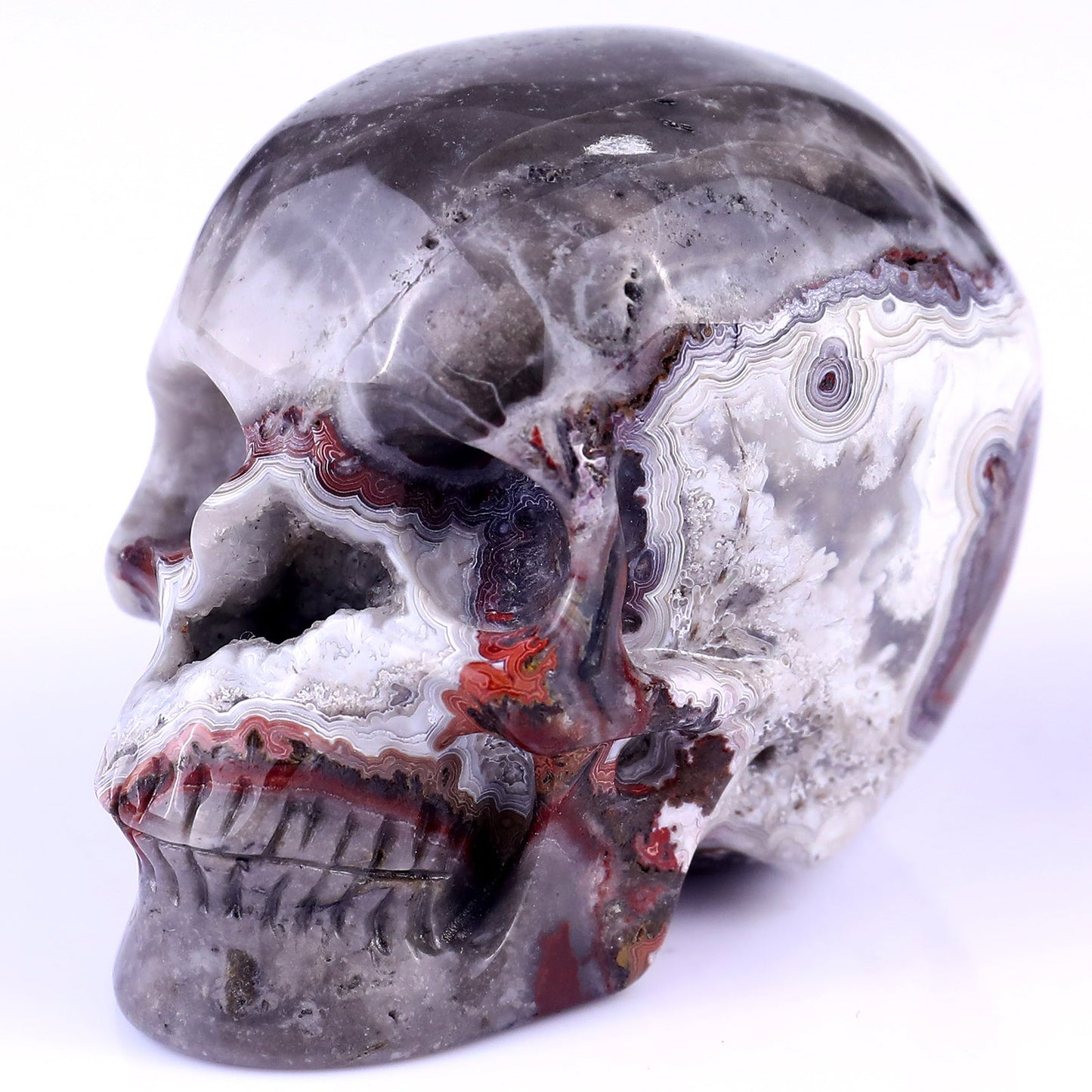 Nicedony 3.0" Red Crazy Lace Agate Hand Carved Geode Skull Sculpture - View 7