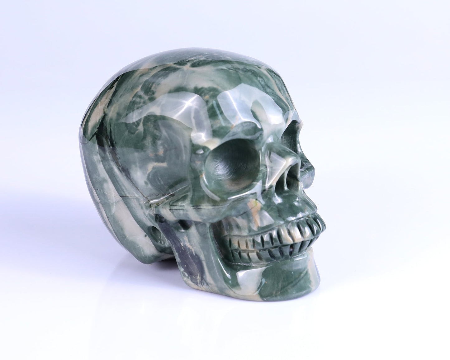 Nicedony 4.3" Jiulong Jade Hand Carved Realistic Skull Sculpture